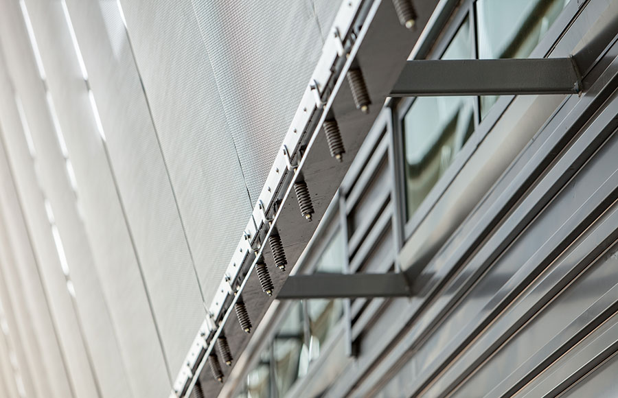 Small town receives new high-tech science facility dressed in a dynamic crystalline metal mesh veil