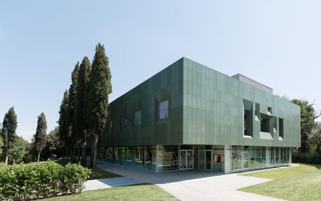 This mental health facility creates calm with a perforated green facade