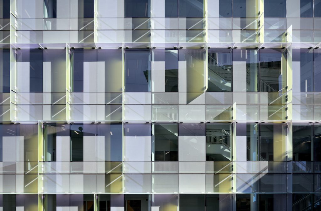 Dichroic glass turns a curtainwall into a shimmering veil